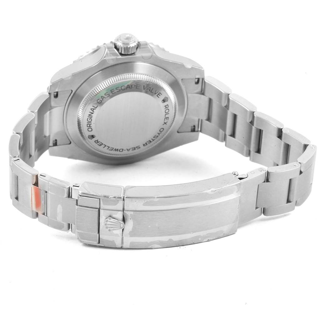 The image shows the back of the Rolex Sea-Dweller 116600 Men
s Stainless Steel Black Dial 116600 Men
s Stainless Steel Black Dial watch case and its stainless steel bracelet with the clasp closed.