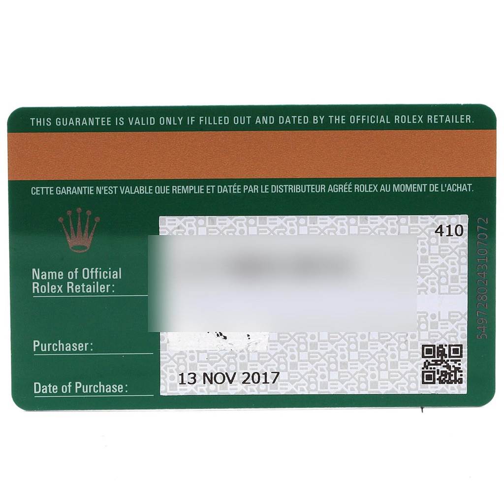 The image shows a green and white Rolex warranty card for the Sea-Dweller model, detailing the purchase date and retailer information.