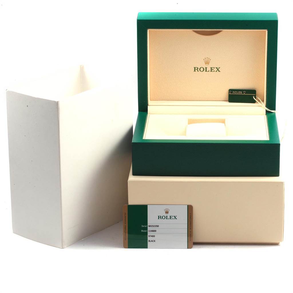 The image shows the packaging and accessories for a Rolex Sea-Dweller 116600 Men
s Stainless Steel Black Dial 116600 Men
s Stainless Steel Black Dial watch, including an open green box, outer box, and certification card.
