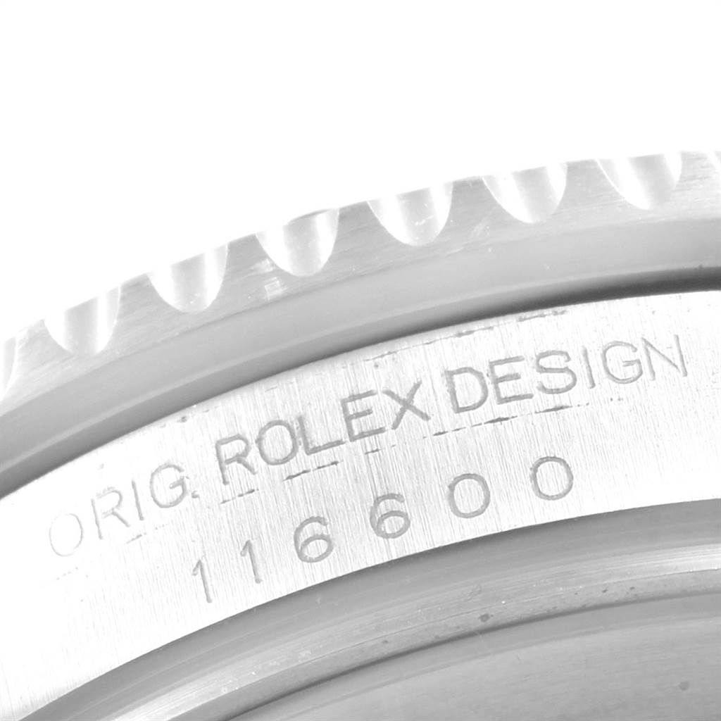 The image shows a close-up of the side of the case of a Rolex Sea-Dweller 116600 Men
s Stainless Steel Black Dial 116600 Men
s Stainless Steel Black Dial model, revealing the serial number "116600" and "ROLEX DESIGN" engraving.