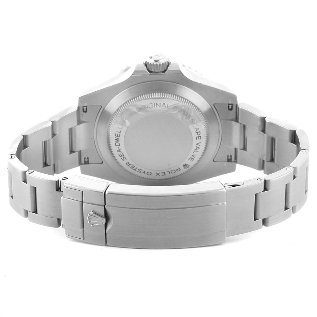 The image shows the back view of the Rolex Sea-Dweller 116600 Men
s Stainless Steel Black Dial 116600 Men
s Stainless Steel Black Dial watch, including its case back and bracelet clasp.