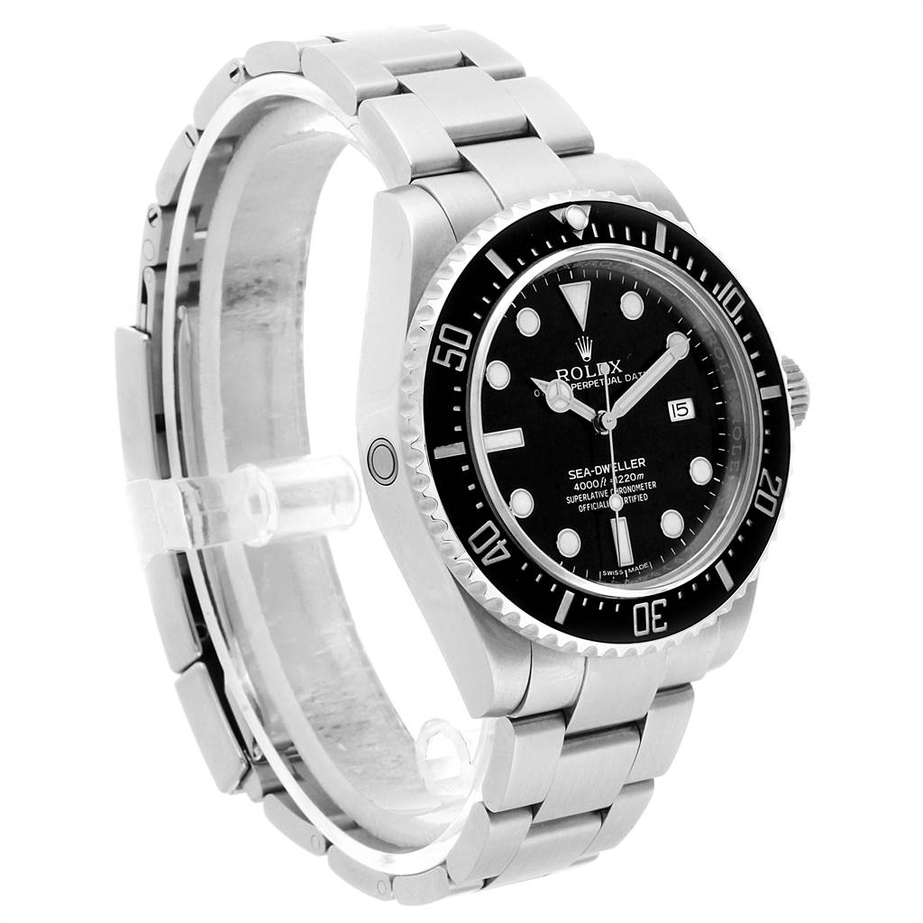 The Rolex Sea-Dweller 116600 Men
s Stainless Steel Black Dial 116600 Men
s Stainless Steel Black Dial watch is shown in a side angle, displaying its dial, bezel, bracelet, and crown.