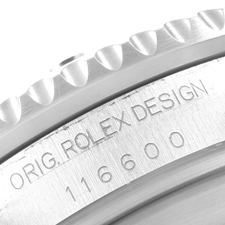 This is a close-up shot of the bezel and the engraved serial number on a Rolex Sea-Dweller 116600 Men
s Stainless Steel Black Dial 116600 Men
s Stainless Steel Black Dial 116600.