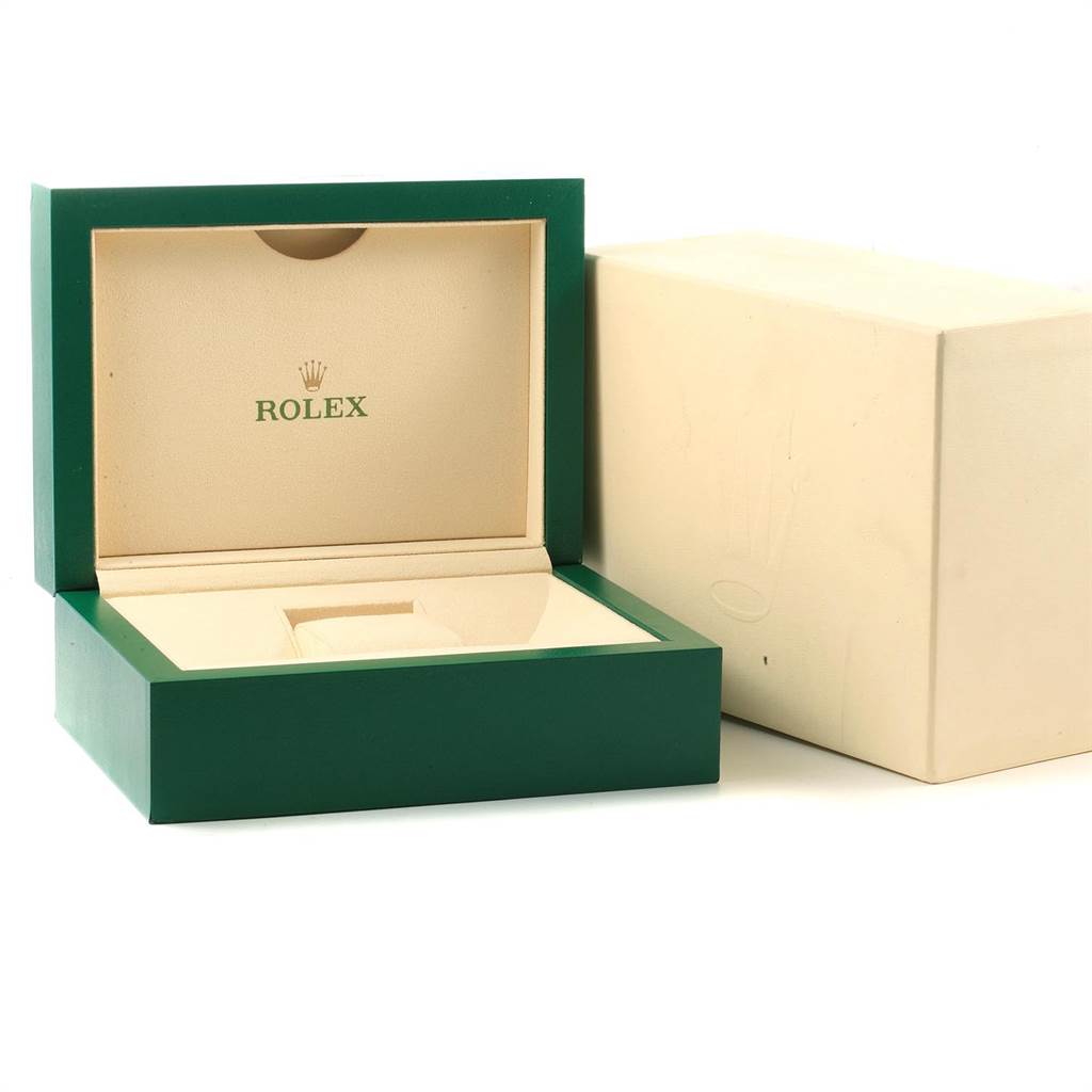 The image shows a green and beige Rolex watch box for the Sea-Dweller model, with the box lid open and an outer box.