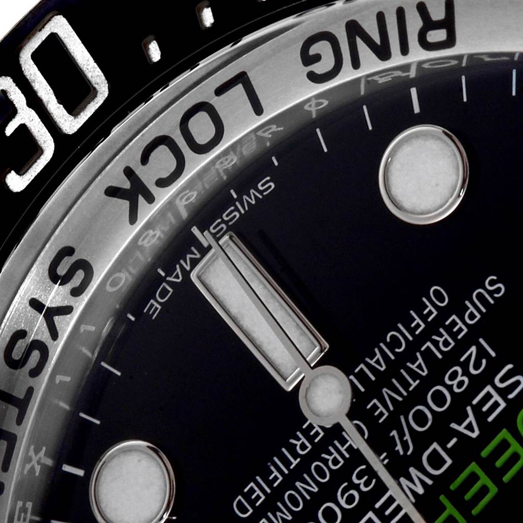 Close-up of the Rolex Sea-Dweller 116660 Men
s Stainless Steel Blue Dial 116660 Men
s Stainless Steel Blue Dial
s dial and part of the bezel, showing the "Ring Lock System" text and the "30" minute mark.