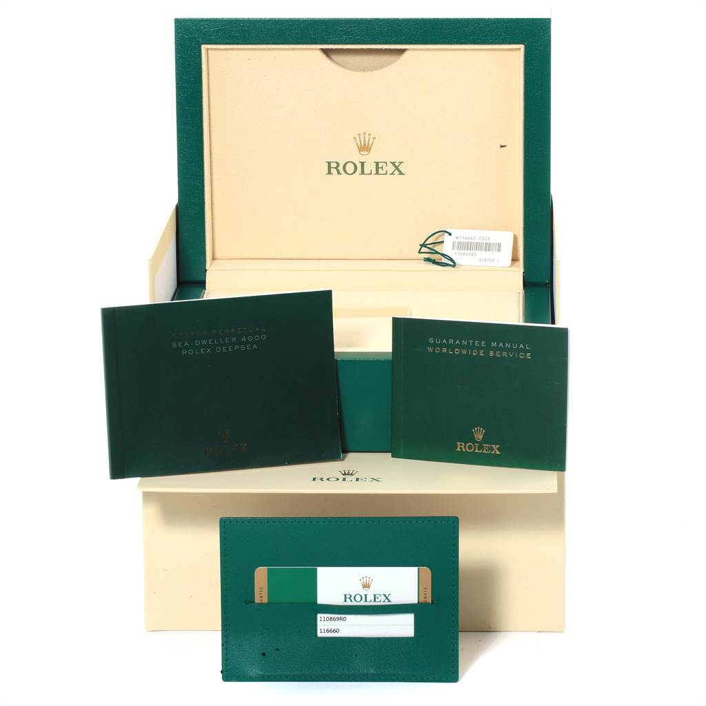 The image shows the box, manuals, and guarantee card for the Rolex Sea-Dweller 116660 Men
s Stainless Steel Blue Dial 116660 Men
s Stainless Steel Blue Dial watch model.