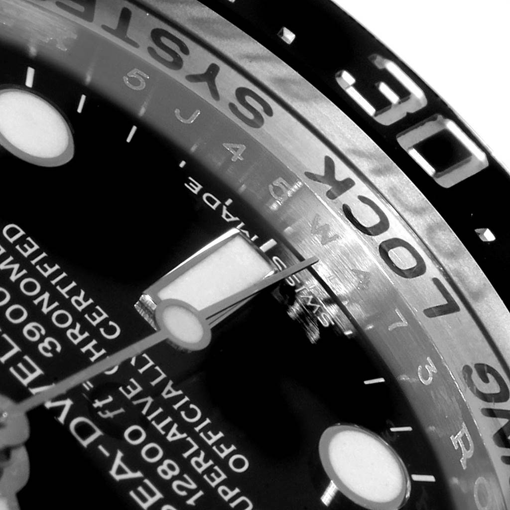 This is a close-up shot of the dial and bezel of the Rolex Sea-Dweller 116660 Men
s Stainless Steel Black Dial 116660 Men
s Stainless Steel Black Dial watch, showing the minute markers and text details.