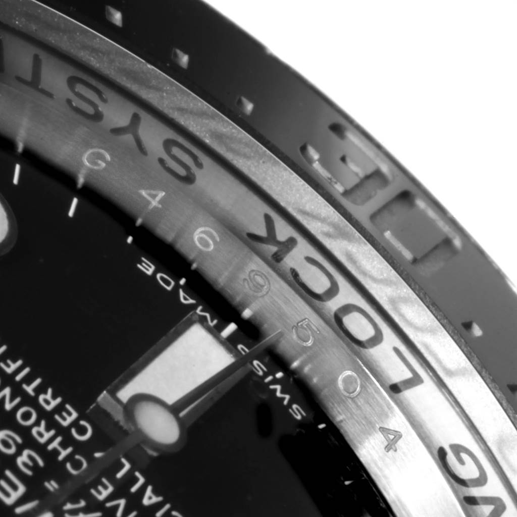 The image shows a close-up angle of the bezel and dial of a Rolex Sea-Dweller 116660 Men's Stainless Steel Blue Dial 116660 Men's Stainless Steel Blue Dial watch, detailing the "LOCK" and minute markers.