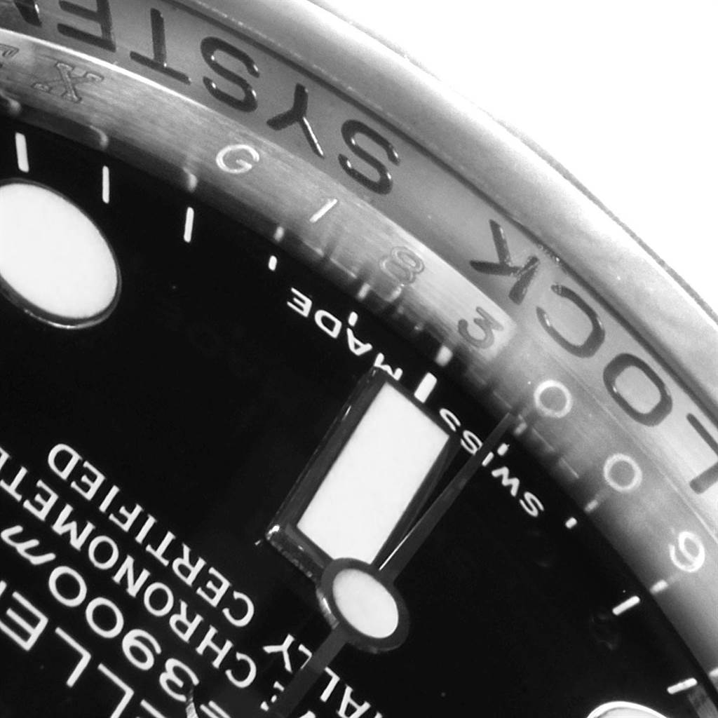 This image shows a close-up of the dial and part of the bezel of the Rolex Sea-Dweller 116660 Men
s Stainless Steel Black Dial 116660 Men
s Stainless Steel Black Dial watch, highlighting the text and markers.
