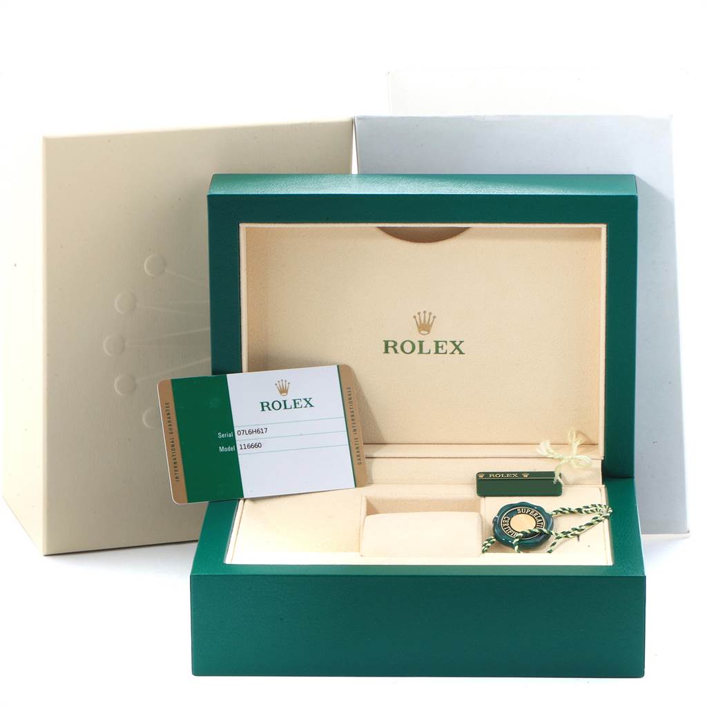 The image shows the open box and accessories for a Rolex Sea-Dweller 116660 Men's Stainless Steel Blue Dial 116660 Men's Stainless Steel Blue Dial, including the warranty card and tags.