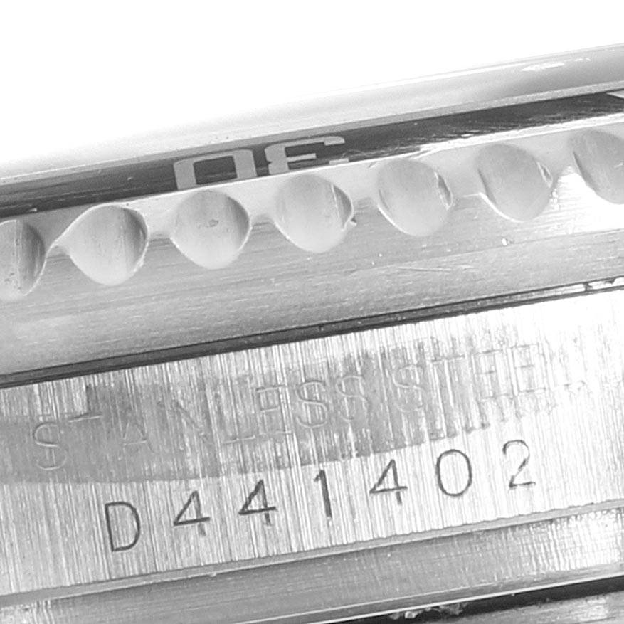The image shows a close-up of the serial number and part of the bezel on the Rolex Sea-Dweller 16600 Men
s Stainless Steel Black Dial 16600 Men
s Stainless Steel Black Dial watch.