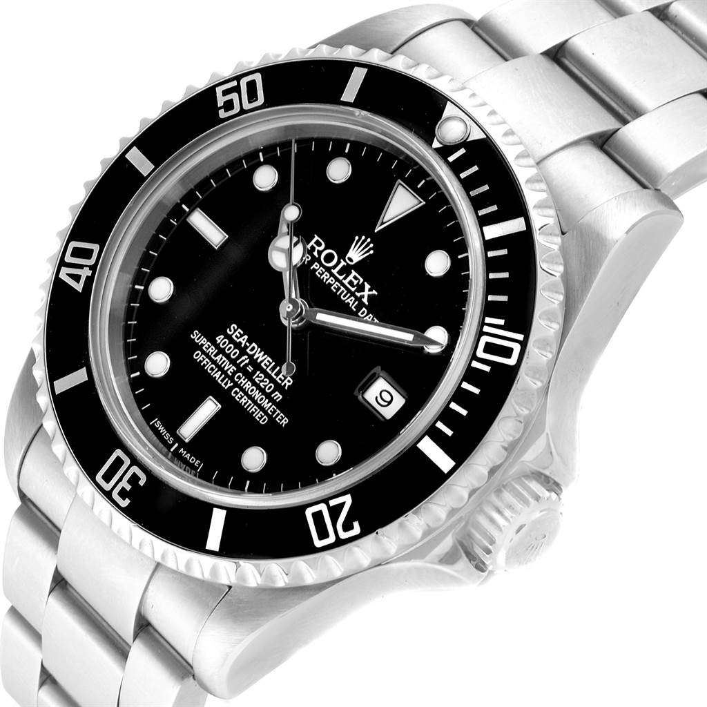The image shows a close-up angled view of the Rolex Sea-Dweller 16600 Men
s Stainless Steel Black Dial 16600 Men
s Stainless Steel Black Dial watch face and part of the metal band.