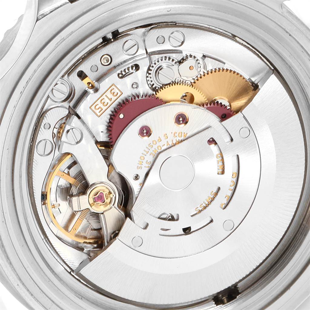 The image shows the movement mechanism of a Rolex Sea-Dweller 16600 Men
s Stainless Steel Black Dial 16600 Men
s Stainless Steel Black Dial watch from a rear angle, revealing its intricate gears and components.