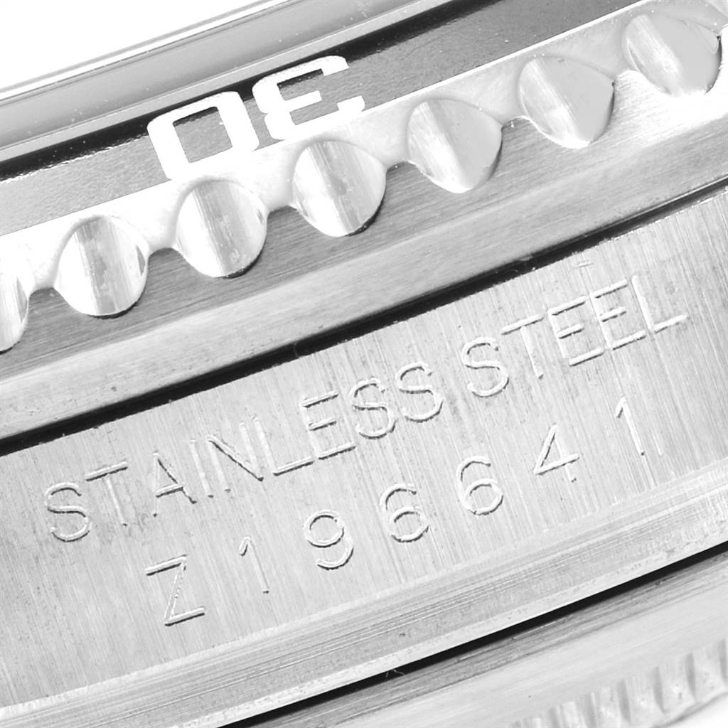 The image shows a close-up of the bezel and case back engraving on a Rolex Sea-Dweller 16600 Men
s Stainless Steel Black Dial 16600 Men
s Stainless Steel Black Dial watch.