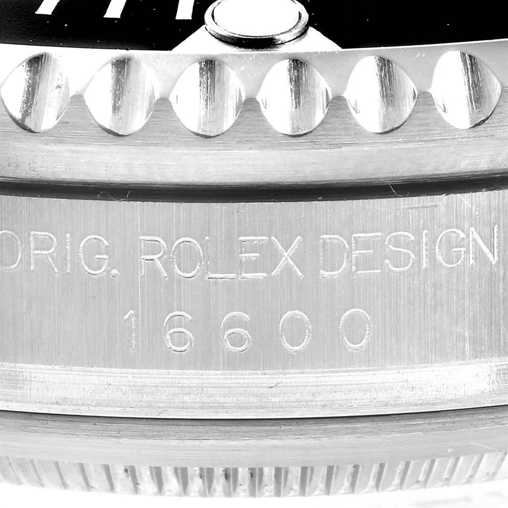 The image shows a close-up of the side view of the Rolex Sea-Dweller 16600 Men
s Stainless Steel Black Dial 16600 Men
s Stainless Steel Black Dial watch, highlighting the bezel and engraved case with the model number 16600.
