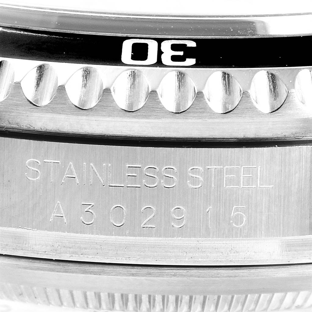 This close-up angle shows the bezel and the stainless steel case with serial number of the Rolex Sea-Dweller 16600 Men
s Stainless Steel Black Dial 16600 Men
s Stainless Steel Black Dial watch.