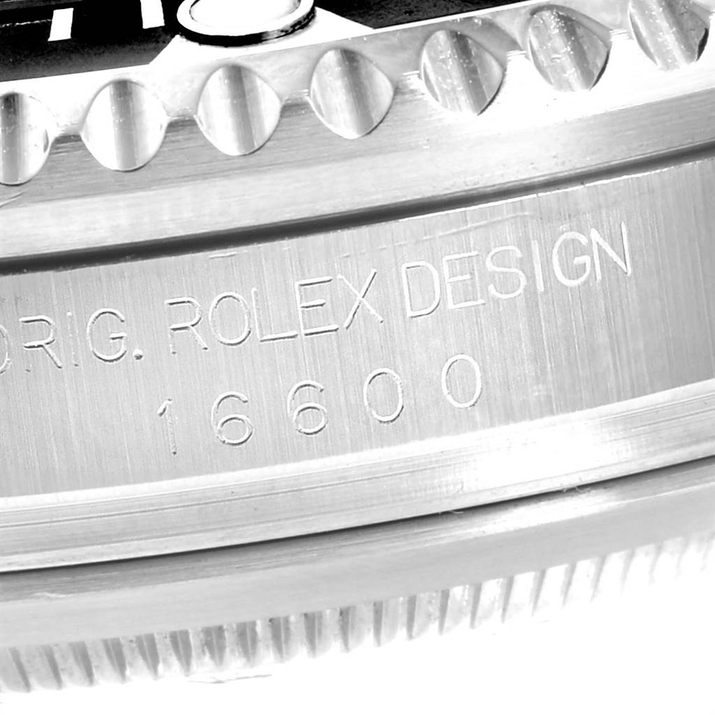 This image shows a close-up of the case side and bezel edge of a Rolex Sea-Dweller 16600 Men
s Stainless Steel Black Dial 16600 Men
s Stainless Steel Black Dial model, with the engraving "ORIG. ROLEX DESIGN 16600".