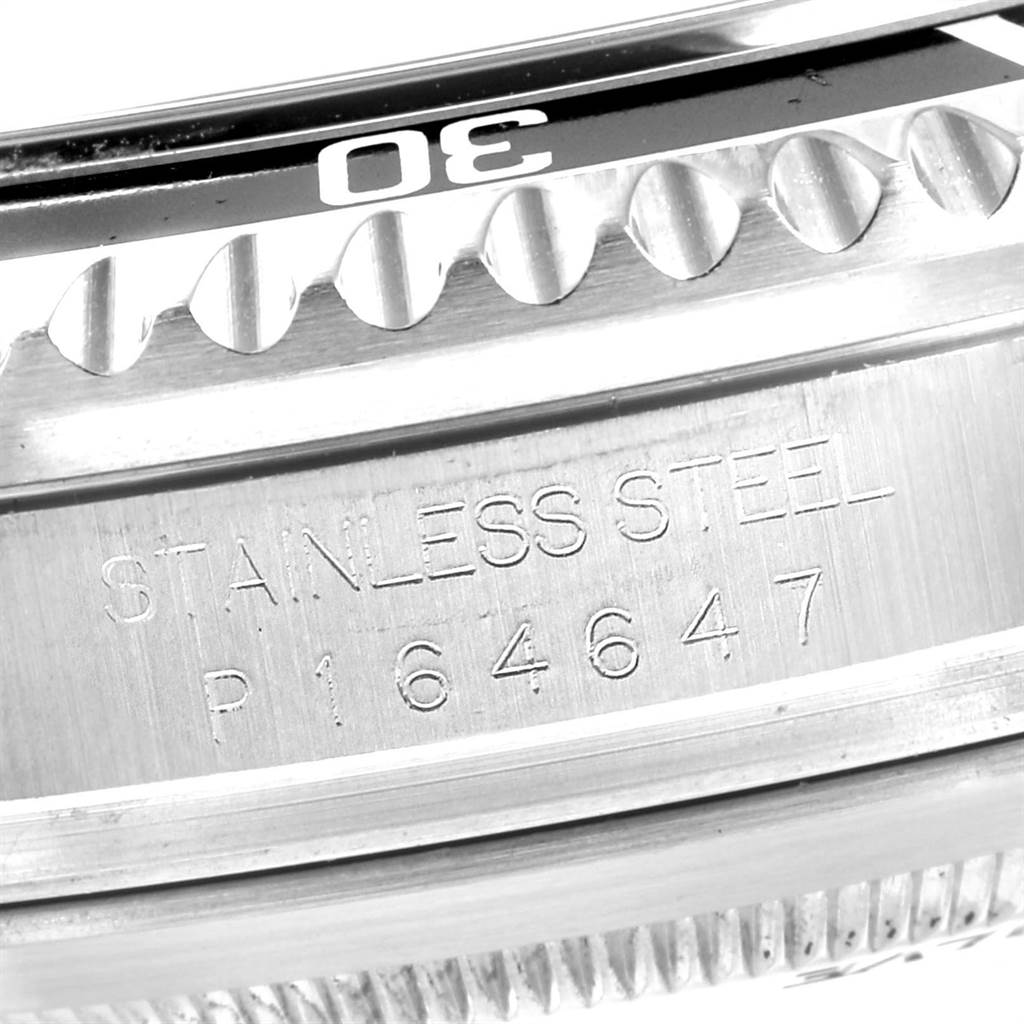 The image shows a close-up of the bezel and engraving on the side of a Rolex Sea-Dweller 16600 Men
s Stainless Steel Black Dial 16600 Men
s Stainless Steel Black Dial watch.