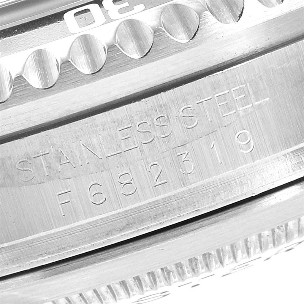 This is a close-up image showing the engraved stainless steel casing and part of the bezel of the Rolex Sea-Dweller 16600 Men
s Stainless Steel Black Dial 16600 Men
s Stainless Steel Black Dial watch.