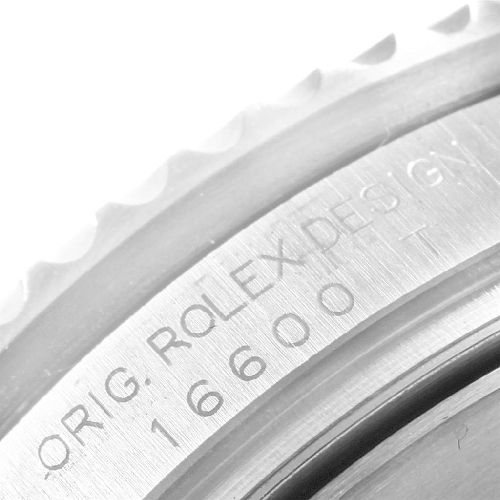 The image shows a close-up of the engraved bezel on the Rolex Sea-Dweller 16600 Men
s Stainless Steel Black Dial 16600 Men
s Stainless Steel Black Dial model 16600.