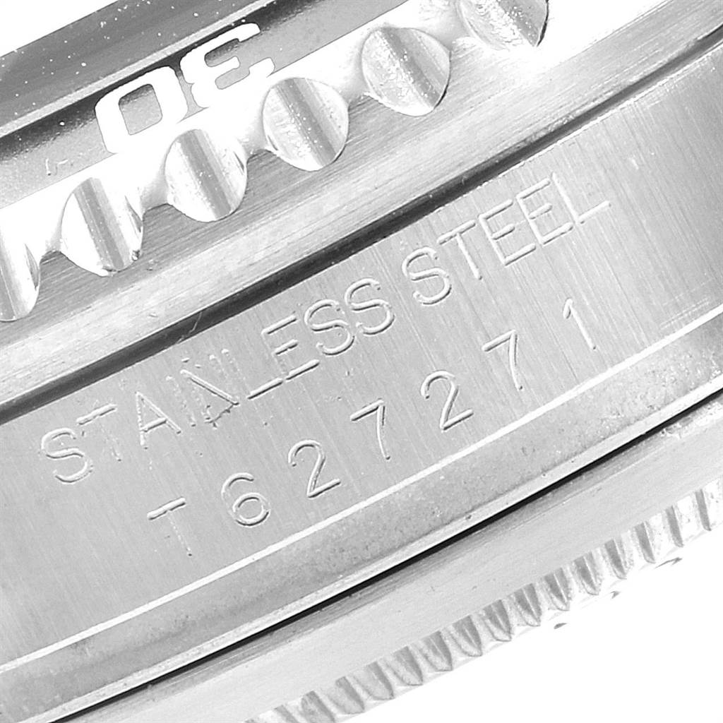 The image shows a close-up of a Rolex Sea-Dweller 16600 Men
s Stainless Steel Black Dial 16600 Men
s Stainless Steel Black Dial watch, highlighting the stainless steel bezel and serial number.