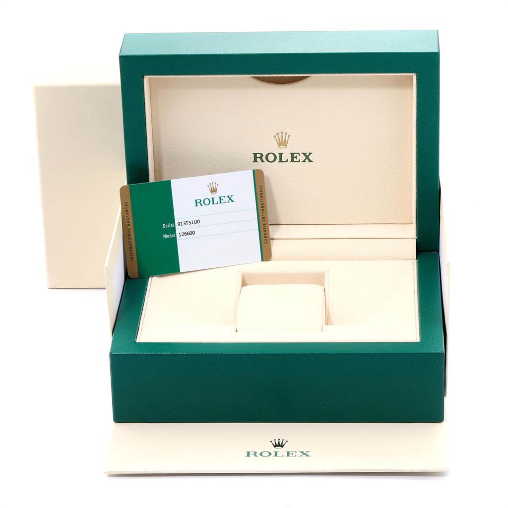 The image shows the open box, warranty card, and packaging of a Rolex Sea-Dweller 126600 Men
s Stainless Steel Black Dial 126600 Men
s Stainless Steel Black Dial model watch.