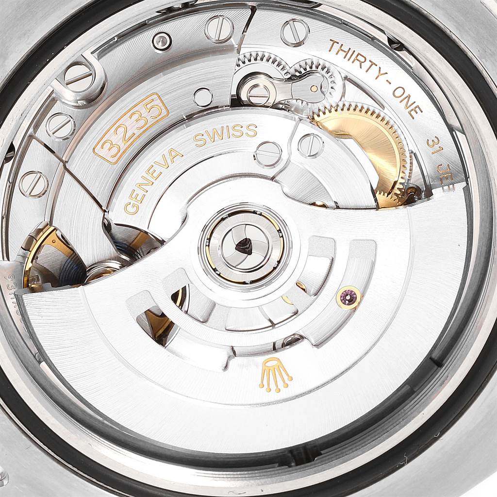This is a close-up view of the movement mechanism of a Rolex Sea-Dweller 126600 Men
s Stainless Steel Black Dial 126600 Men
s Stainless Steel Black Dial watch, showcasing intricate gears and components.