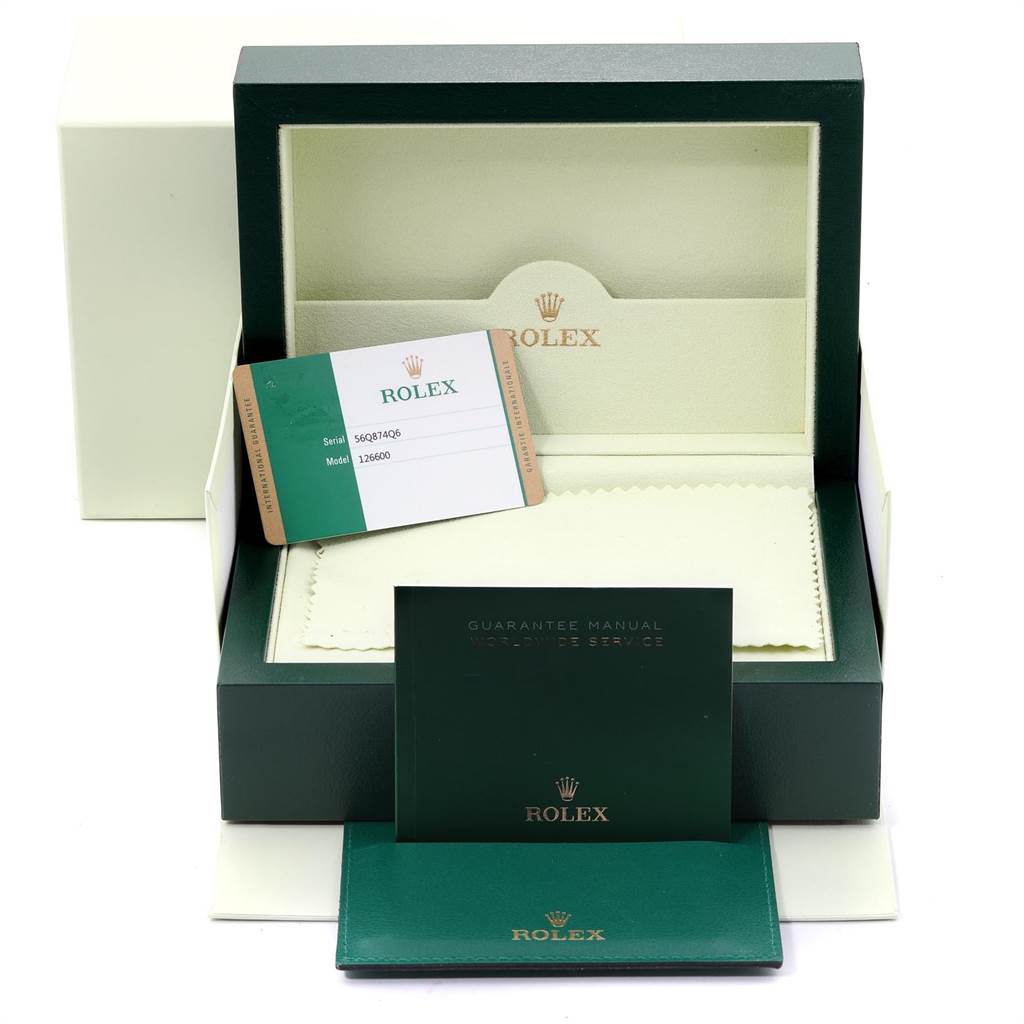 The image shows a Rolex Sea-Dweller 126600 Men
s Stainless Steel Black Dial 126600 Men
s Stainless Steel Black Dial watch box, warranty card, and guarantee manual from a frontal angle.