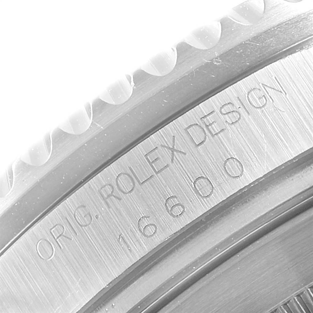This image shows a close-up of the caseback edge of a Rolex Sea-Dweller 16600 Men
s Stainless Steel Black Dial 16600 Men
s Stainless Steel Black Dial watch, displaying the model number 16800 and "ORIG. ROLEX DESIGN" engraving.