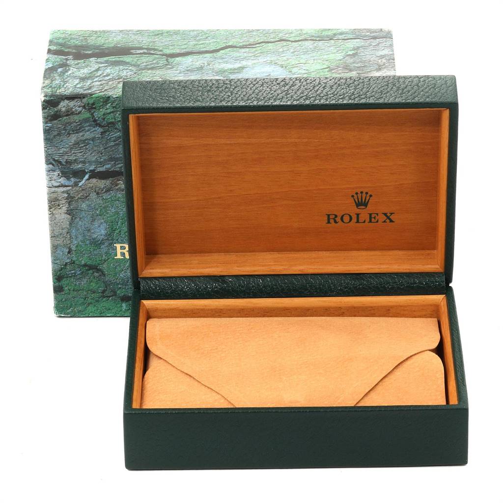 The image shows the open box of the Rolex Sea-Dweller 16600 Men
s Stainless Steel Black Dial 16600 Men
s Stainless Steel Black Dial watch, featuring a green and wood finish with the Rolex logo inside.