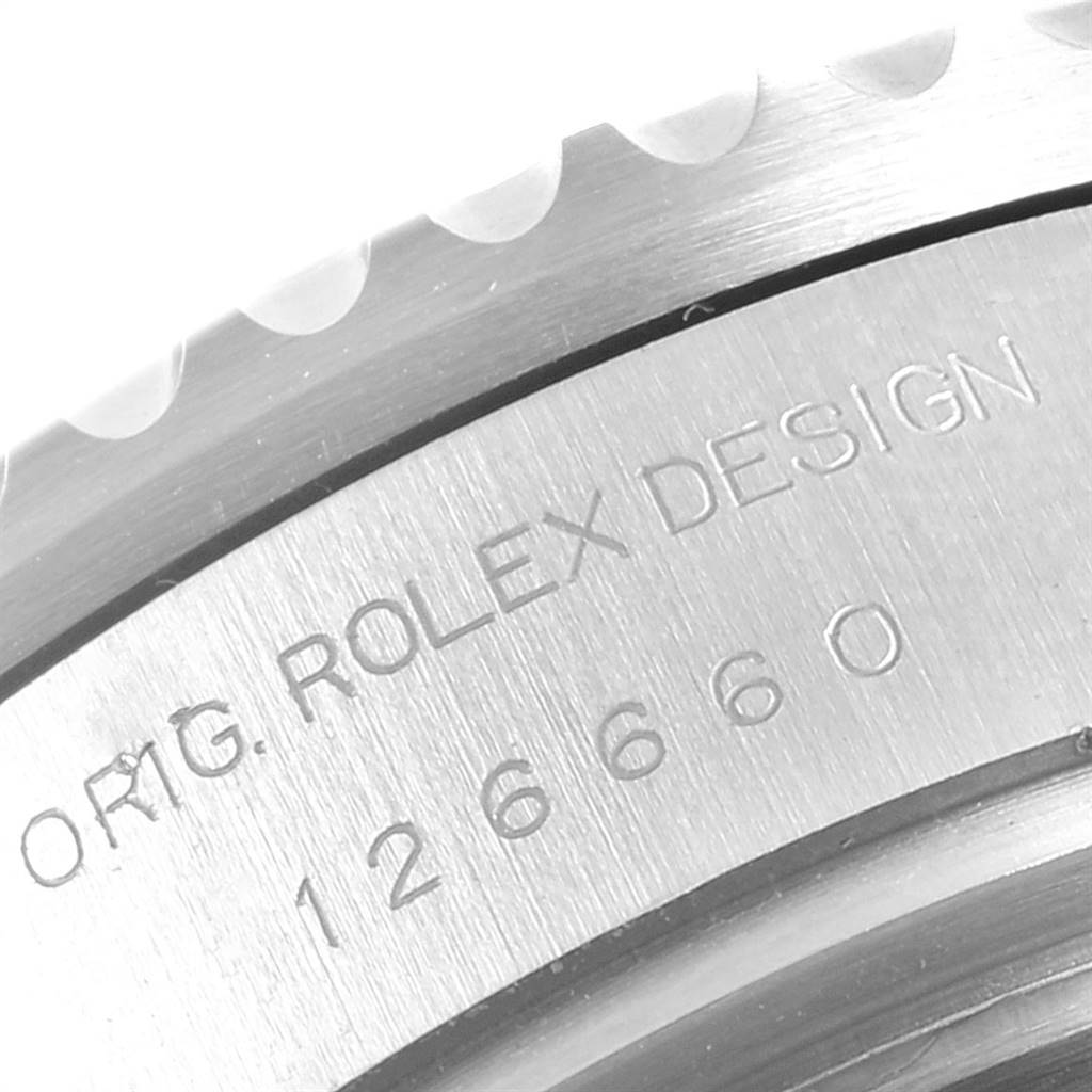 The image shows a close-up of the engraved case back of a Rolex Sea-Dweller 126660 Men
s Stainless Steel Blue Dial 126660 Men
s Stainless Steel Blue Dial watch from an oblique top angle.