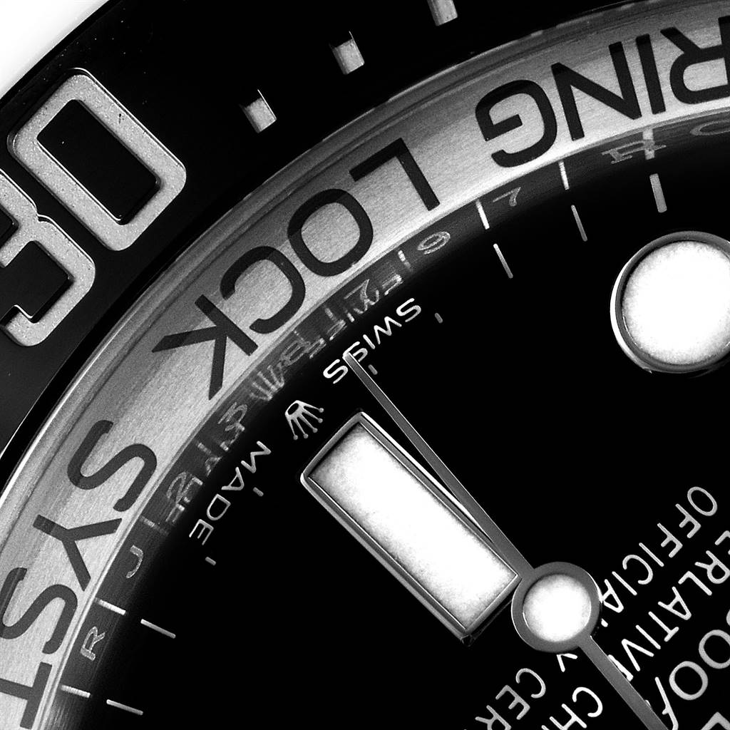 This close-up angle of the Rolex Sea-Dweller 126660 Men
s Stainless Steel Blue Dial 126660 Men
s Stainless Steel Blue Dial watch showcases the dial, minute hand, and "RING LOCK SYSTEM" text on the bezel.