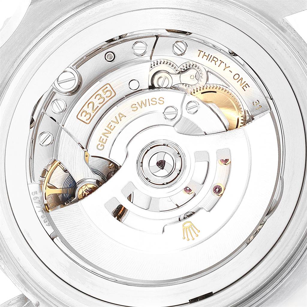 The image shows the back of a Rolex Sea-Dweller 126660 Men
s Stainless Steel Blue Dial 126660 Men
s Stainless Steel Blue Dial watch highlighting its intricate inner mechanism and rotor.