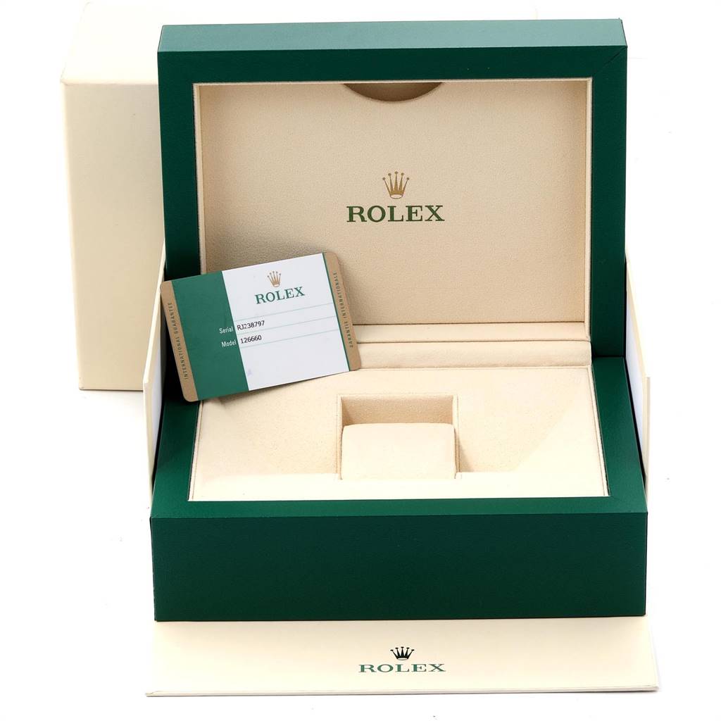 The image shows an empty Rolex Sea-Dweller 126660 Men
s Stainless Steel Blue Dial 126660 Men
s Stainless Steel Blue Dial watch box with a warranty card inside.