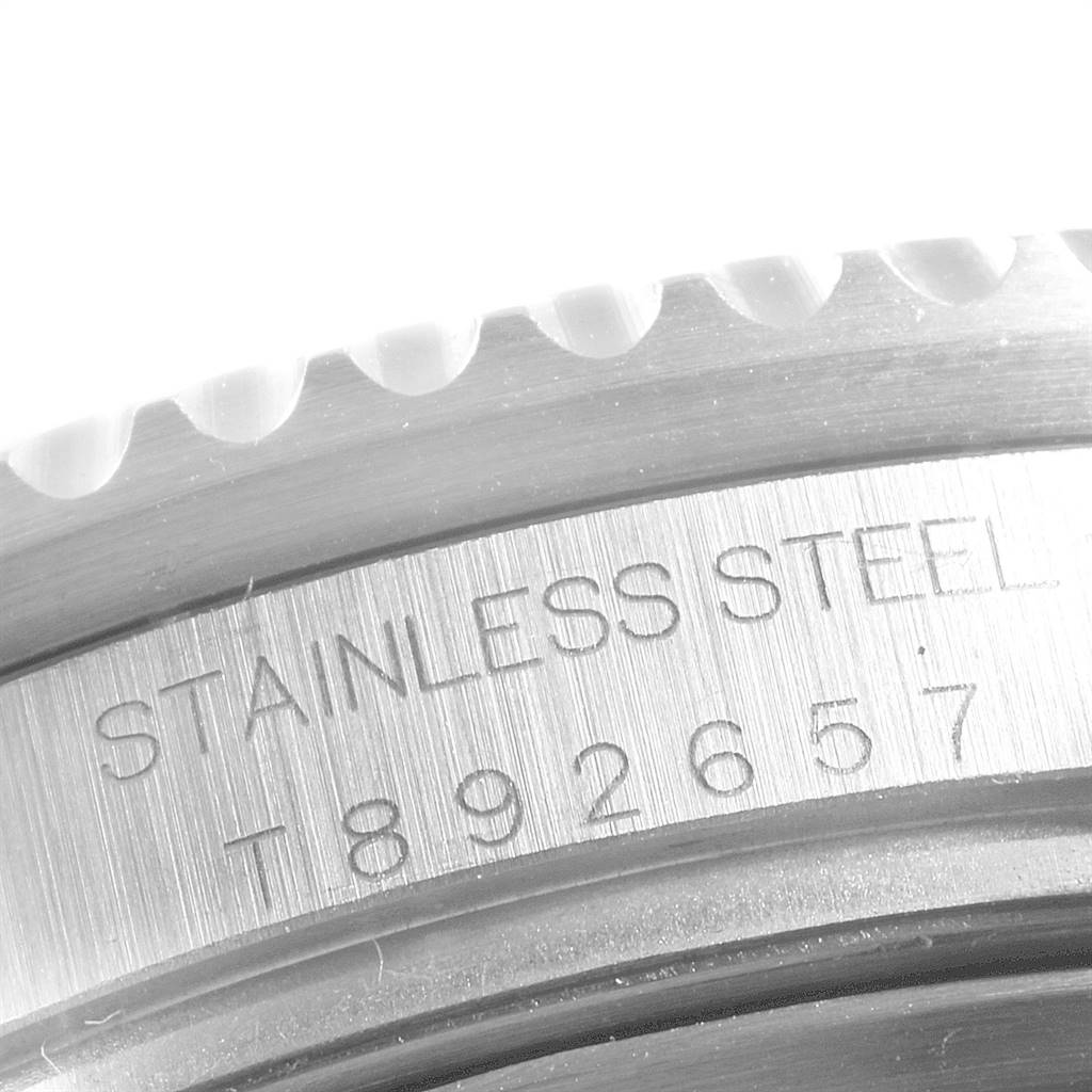 The image shows a close-up of the stainless steel case
s side and bezel teeth of a Rolex Sea-Dweller 16600 Men
s Stainless Steel Black Dial 16600 Men
s Stainless Steel Black Dial watch.
