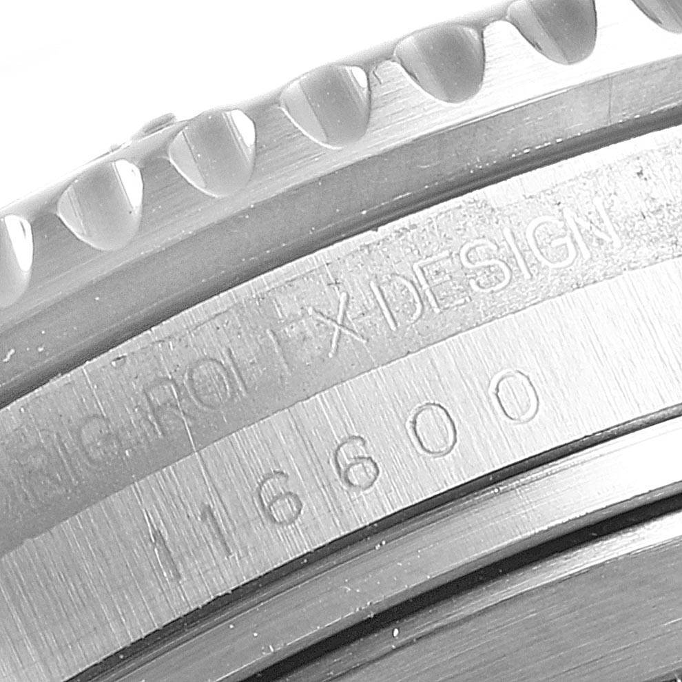 The image shows a close-up of the engraved bezel and case of a Rolex Sea-Dweller 116600 Men
s Stainless Steel Black Dial 116600 Men
s Stainless Steel Black Dial watch, model number 16600.