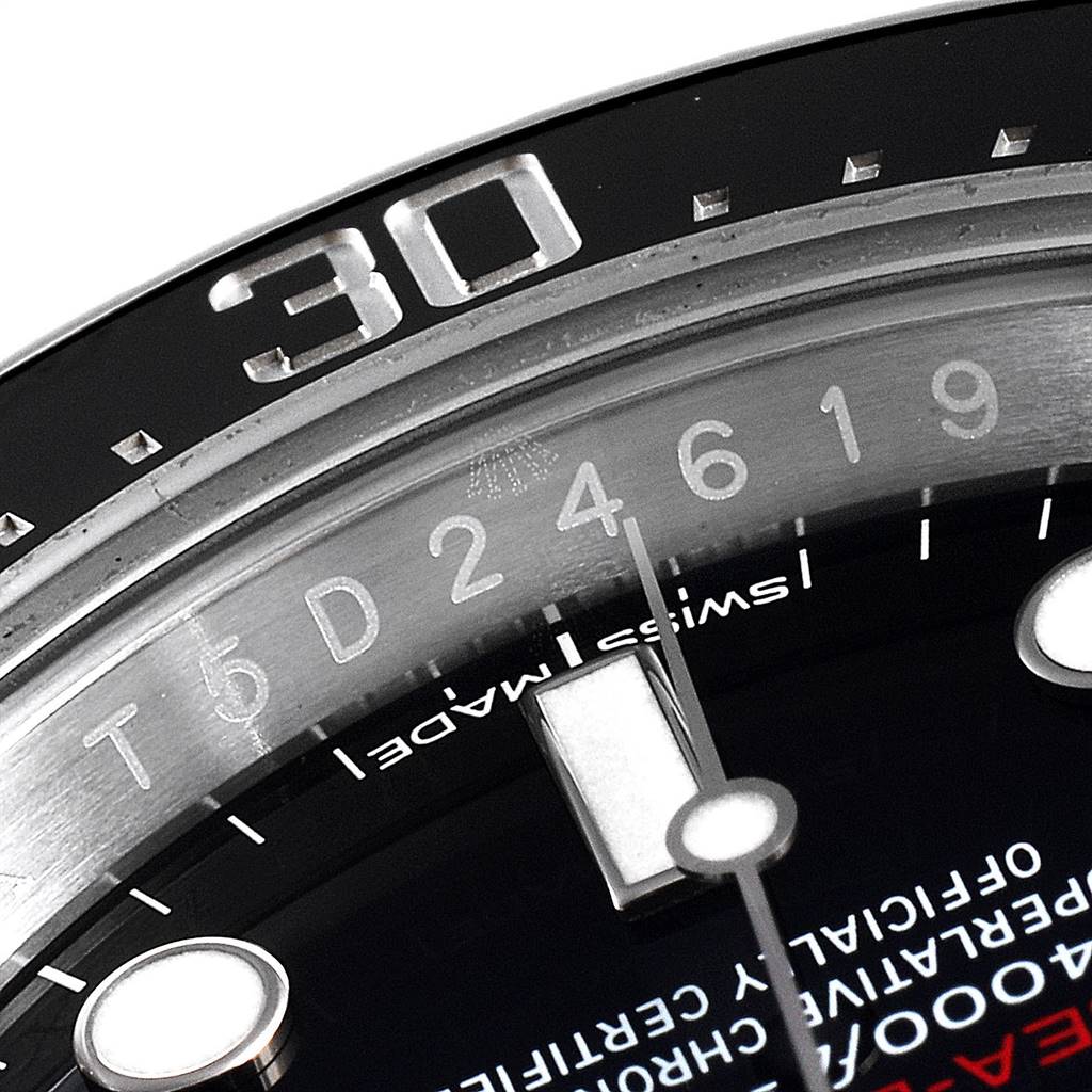 The image shows a close-up of the bezel and part of the dial of the Rolex Sea-Dweller 126600 Men's Stainless Steel Black Dial 126600 Men's Stainless Steel Black Dial watch.
