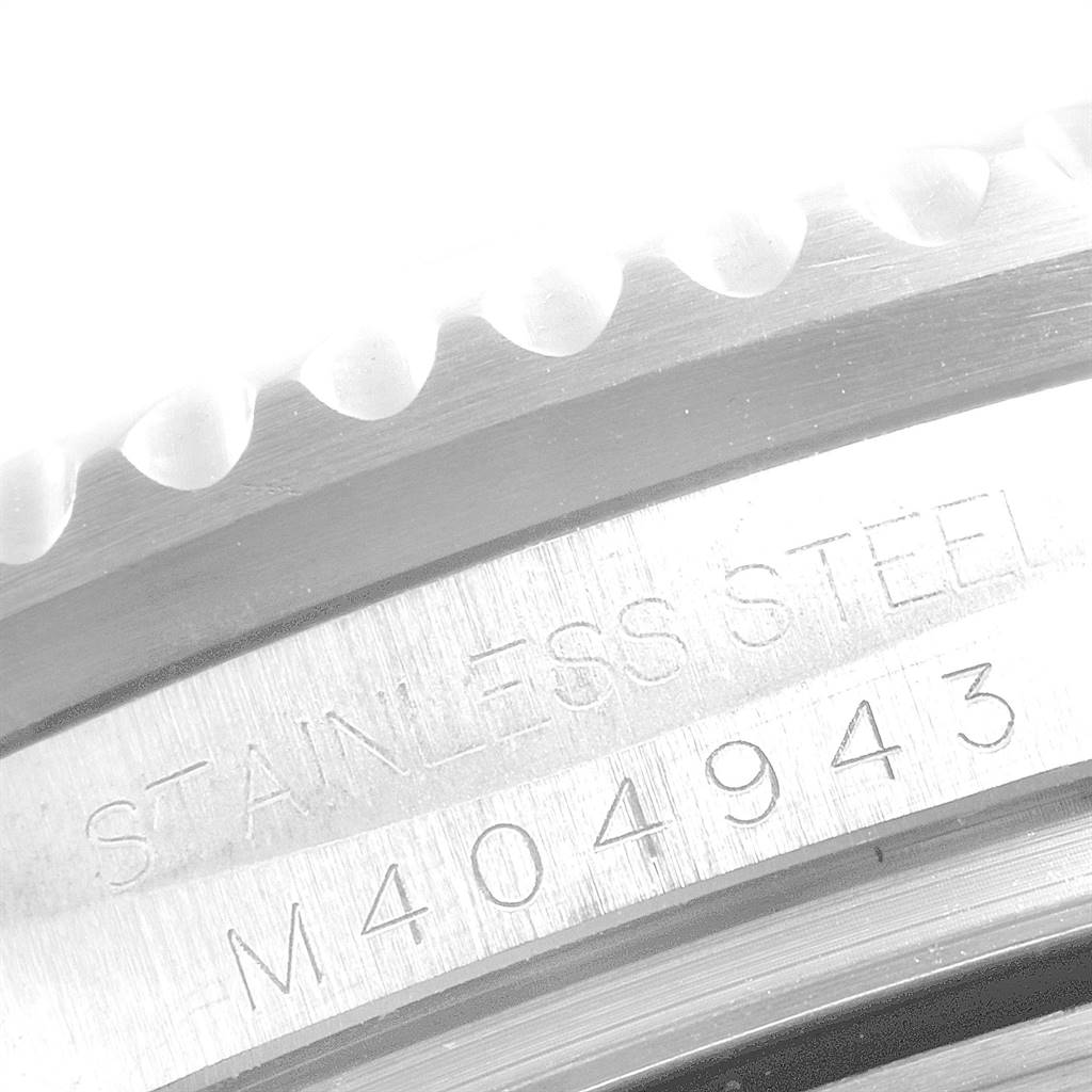 The image shows a close-up view of the case edge with the serial number and "STAINLESS STEEL" engraving on a Rolex Sea-Dweller 16600 Men
s Stainless Steel Black Dial 16600 Men
s Stainless Steel Black Dial watch.