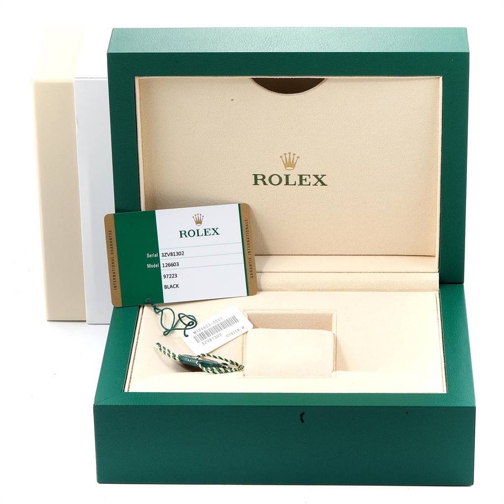 The image shows an open green Rolex box for the Sea-Dweller model with a warranty card and tags inside.