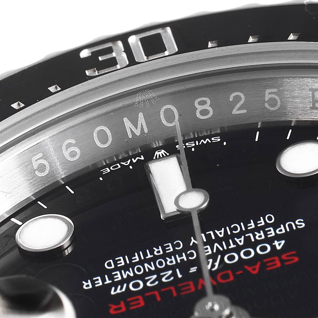 This image shows a close-up of the dial and bezel, including the minute markers, numbers, and part of the hand, of a Rolex Sea-Dweller 126600 Men
s Stainless Steel Black Dial 126600 Men
s Stainless Steel Black Dial watch.