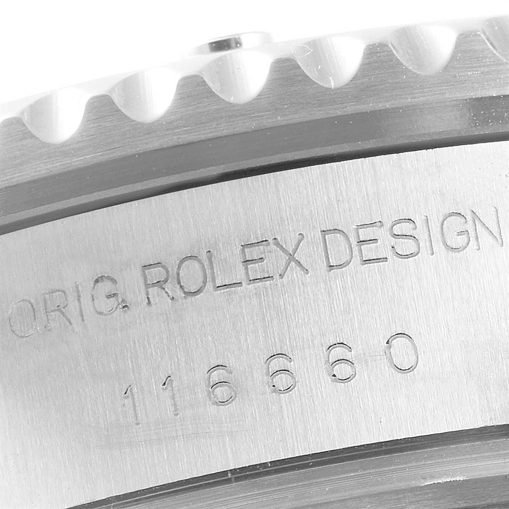This close-up image shows the case side engraving and part of the bezel of a Rolex Sea-Dweller 116660 Men
s Stainless Steel Black Dial 116660 Men
s Stainless Steel Black Dial watch.