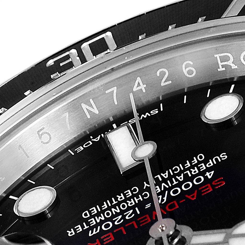 This close-up image of a Rolex Sea-Dweller 126600 Men
s Stainless Steel Black Dial 126600 Men
s Stainless Steel Black Dial watch shows part of the dial, minute hand, and bezel.