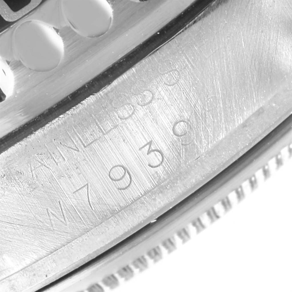The image shows a close-up of the case side of a Rolex Sea-Dweller 16600 Men
s Stainless Steel Black Dial 16600 Men
s Stainless Steel Black Dial watch, highlighting its engraved serial number.