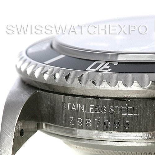 The image shows an angled close-up of the bezel, case, and part of the serial number on a Rolex Sea-Dweller 16600 Men's Stainless Steel Black Dial 16600 Men's Stainless Steel Black Dial watch.