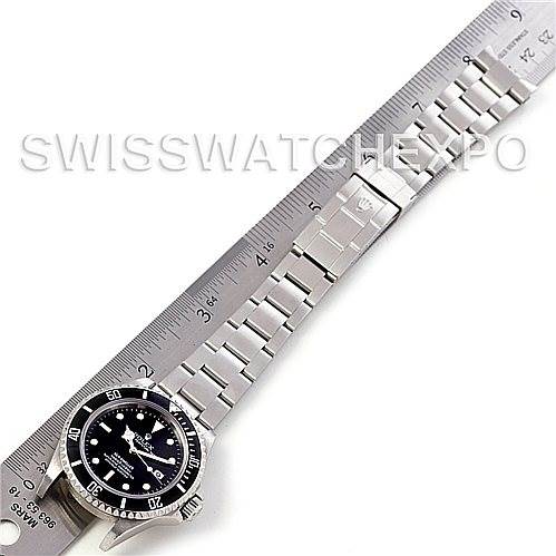 The image shows a Rolex Sea-Dweller 16600 Men's Stainless Steel Black Dial 16600 Men's Stainless Steel Black Dial watch along with its bracelet measured against a ruler, viewed from above.