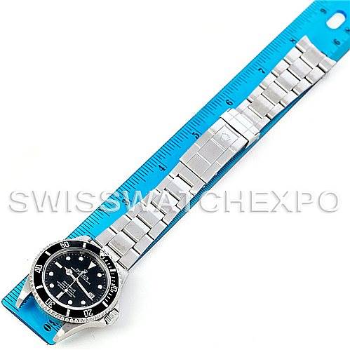 The image shows a Rolex Sea-Dweller 16600 Men's Stainless Steel Black Dial 16600 Men's Stainless Steel Black Dial watch laid flat against a blue ruler, displaying the face and full metal bracelet.