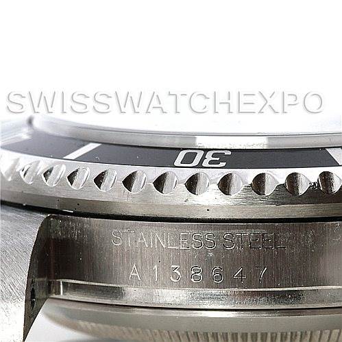 This close-up image of the Rolex Sea-Dweller 16600 Men's Stainless Steel Black Dial 16600 Men's Stainless Steel Black Dial watch shows the bezel with a 30-marking and the case back with "STAINLESS STEEL" and a serial number.