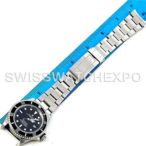The image shows a Rolex Sea-Dweller 16600 Men's Stainless Steel Black Dial 16600 Men's Stainless Steel Black Dial watch positioned flat with a blue ruler alongside it.