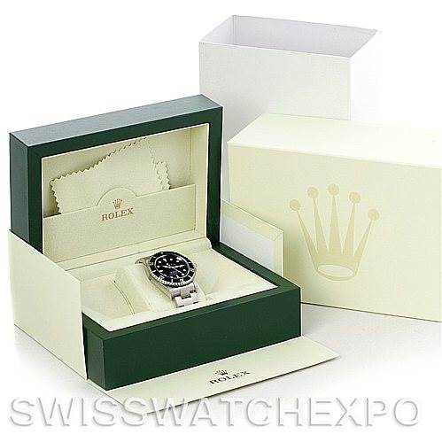 The image shows a Rolex Sea-Dweller 16600 Men's Stainless Steel Black Dial 16600 Men's Stainless Steel Black Dial watch at an angled view in its open green and cream box, with a cleaning cloth and outer packaging visible.