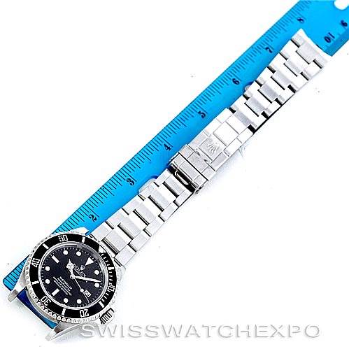 The image shows the entire Rolex Sea-Dweller 16600 Men's Stainless Steel Black Dial 16600 Men's Stainless Steel Black Dial watch laid flat with its band extended next to a ruler for measurement.